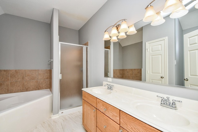 full bath with a garden tub, double vanity, a sink, and a shower stall