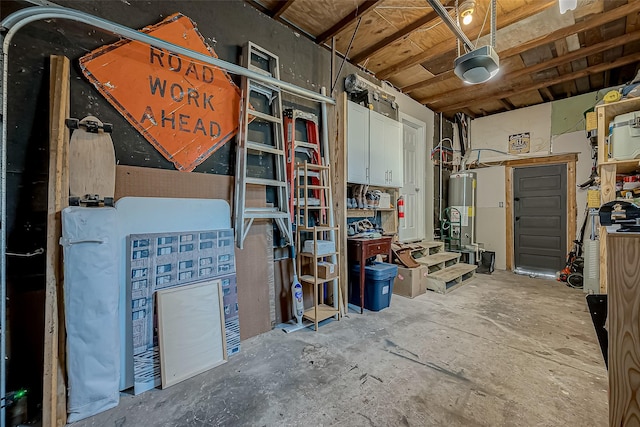 storage area featuring a garage and water heater