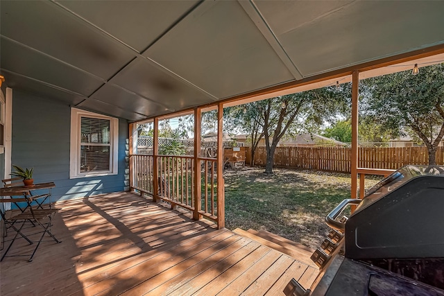 deck featuring a fenced backyard and a grill