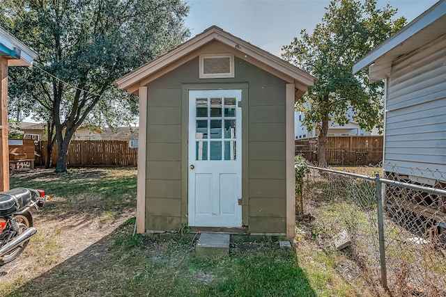 view of shed featuring a fenced backyard