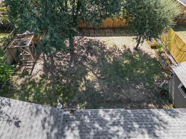 view of yard with a garden and a fenced backyard