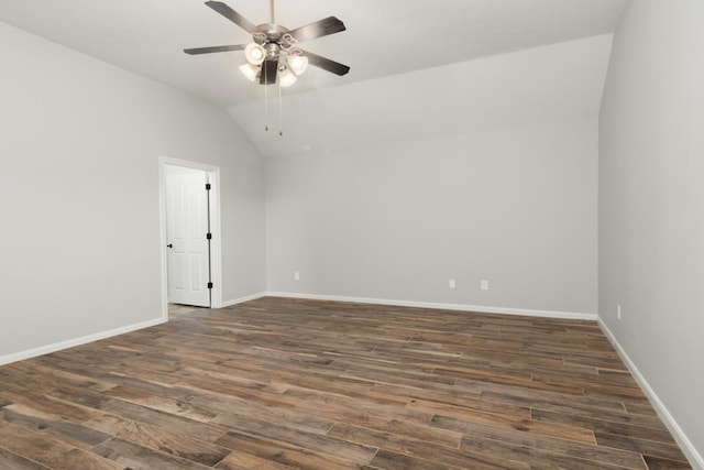 spare room with dark wood-style floors, ceiling fan, lofted ceiling, and baseboards