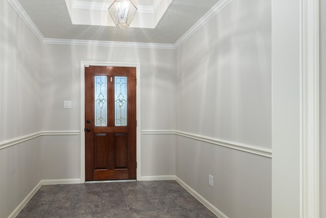 entrance foyer featuring crown molding, baseboards, and a textured ceiling