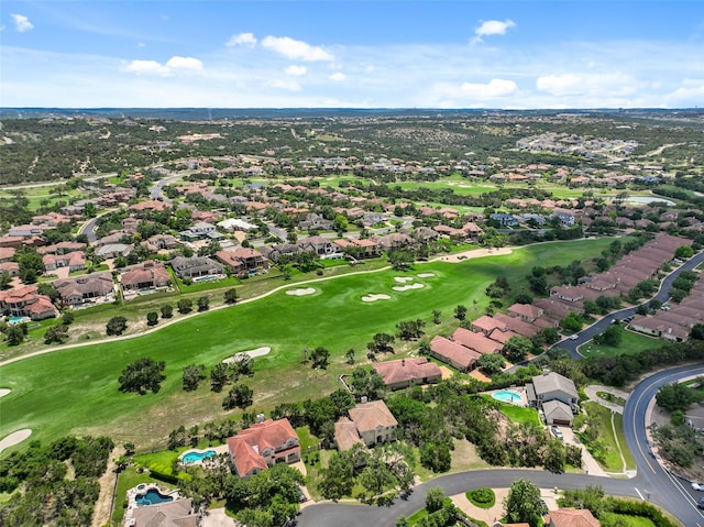 drone / aerial view with a residential view and golf course view