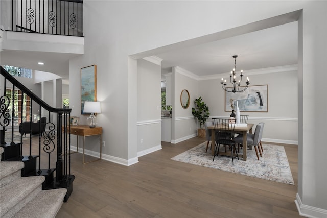 dining space featuring baseboards, a wealth of natural light, and wood finished floors