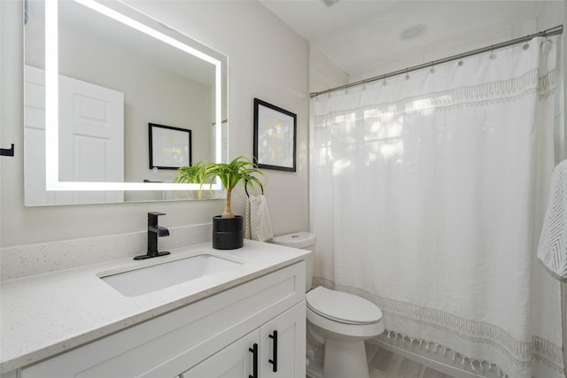 full bath featuring toilet and vanity