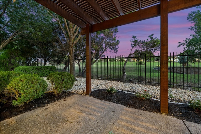 view of patio featuring fence and a pergola