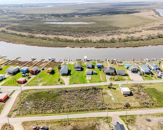 aerial view with a water view and a residential view