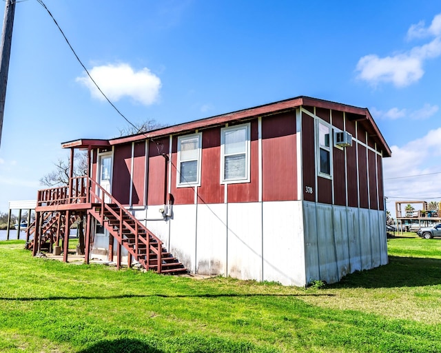 exterior space featuring a lawn and stairway