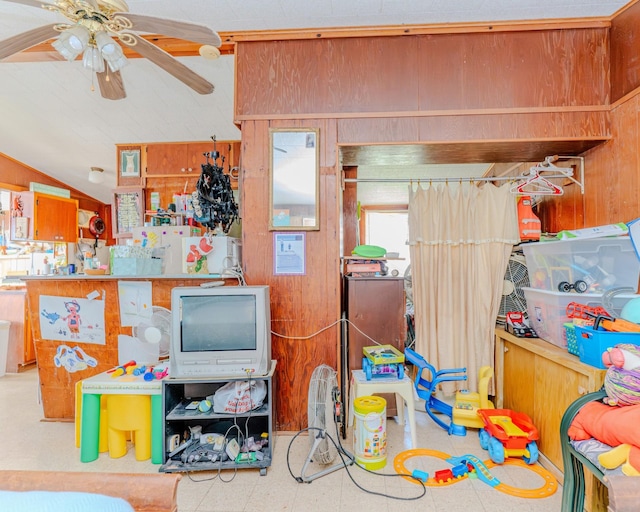 game room with vaulted ceiling, ceiling fan, and light floors