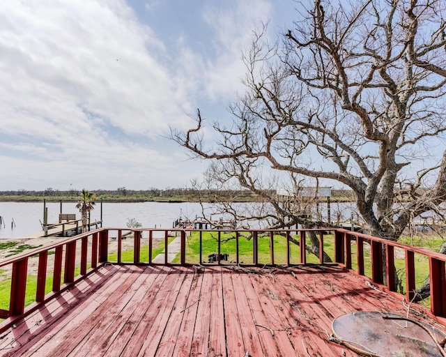 wooden terrace with a water view