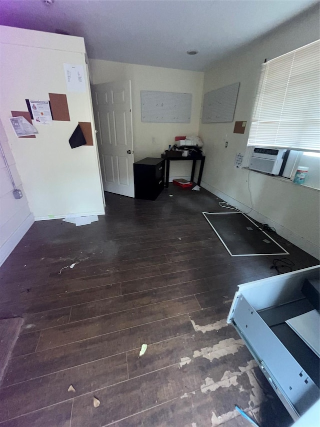 interior space featuring dark wood finished floors and baseboards