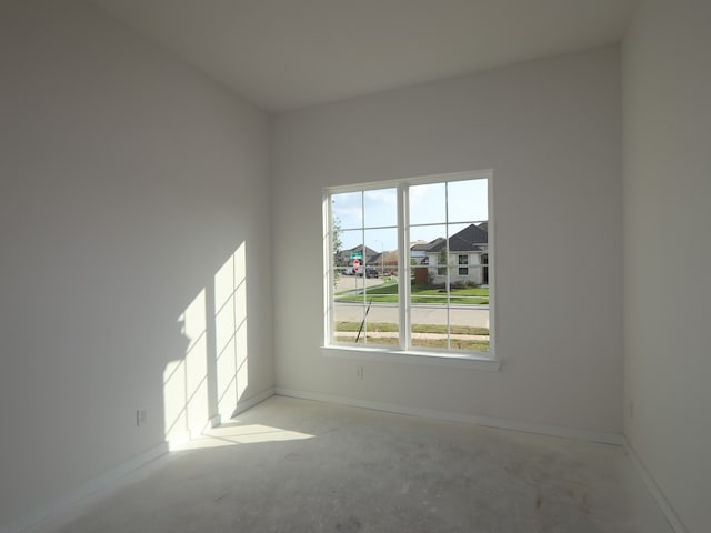 8502 Pier Cove Dr, Cypress, TX 77433 - spare room with baseboards and concrete floors
