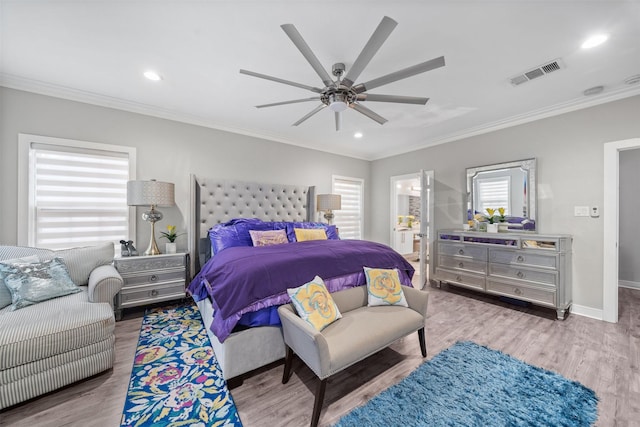 bedroom with baseboards, visible vents, wood finished floors, and ornamental molding