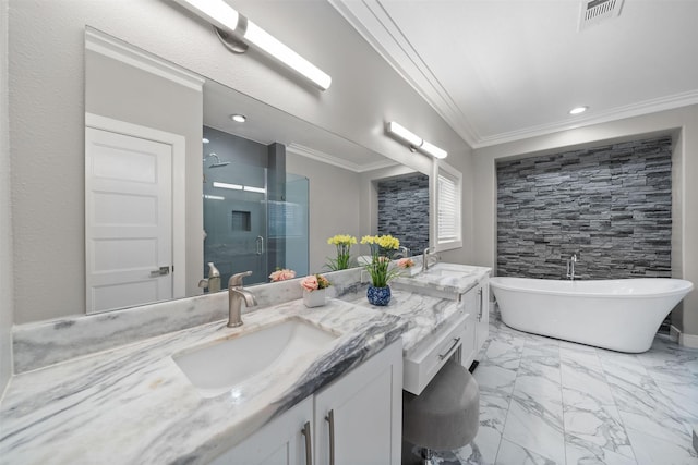 bathroom featuring marble finish floor, visible vents, a freestanding bath, a sink, and a shower stall