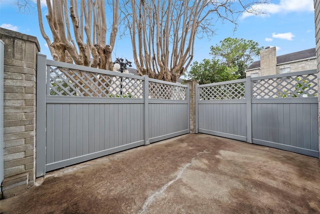 view of gate featuring fence