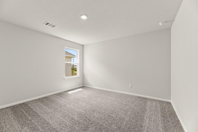 16539 Willow Forest Dr, Conroe, TX 77302 - carpeted spare room with baseboards and a smoke detector
