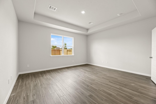 16539 Willow Forest Dr, Conroe, TX 77302 - spare room featuring a raised ceiling, dark wood finished floors, baseboards, and recessed lighting