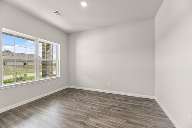 16539 Willow Forest Dr, Conroe, TX 77302 - unfurnished room featuring dark wood-type flooring and baseboards