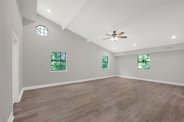 unfurnished room featuring visible vents, beamed ceiling, light wood finished floors, and baseboards