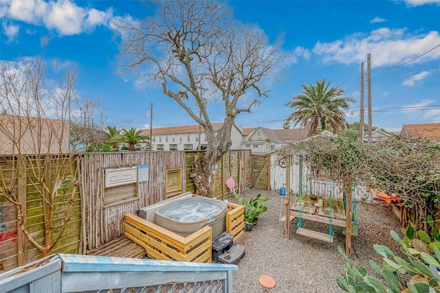 912 Broadway St, Galveston, TX 77550 - view of yard with a hot tub and a fenced backyard