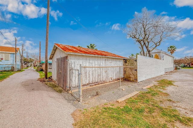 view of outdoor structure with fence