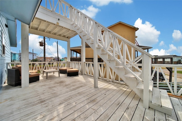 deck featuring stairs and an outdoor hangout area