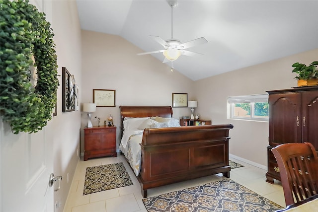 bedroom featuring lofted ceiling, light tile patterned floors, baseboards, and a ceiling fan