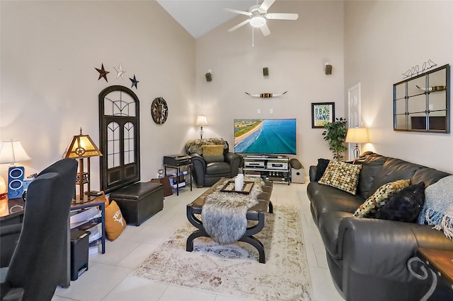 living room featuring a ceiling fan, high vaulted ceiling, and light tile patterned floors