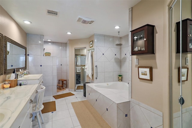 bathroom with a garden tub, tile walls, visible vents, a shower stall, and tile patterned flooring