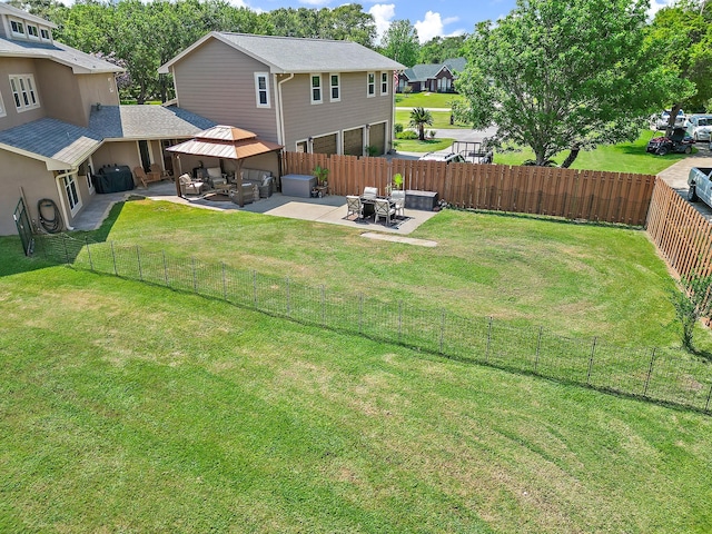 view of yard featuring a gazebo, an outdoor hangout area, a patio area, a residential view, and a fenced backyard