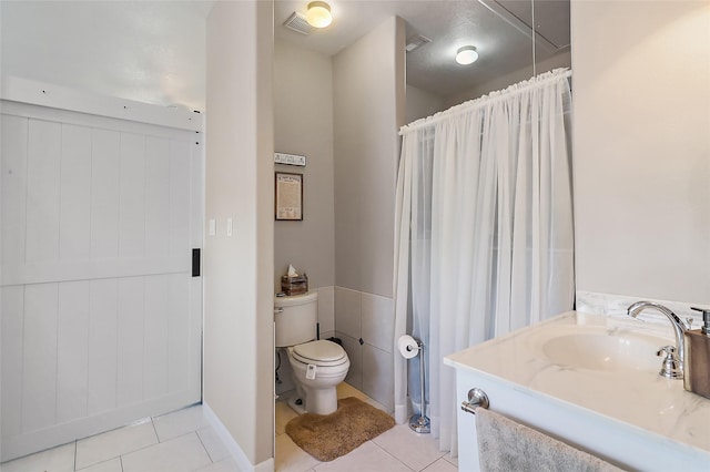 full bath featuring toilet, tile patterned flooring, visible vents, and vanity