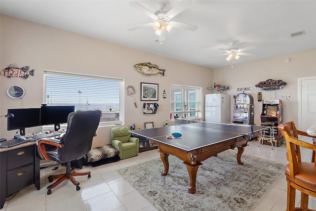 playroom featuring light tile patterned flooring, visible vents, and a ceiling fan