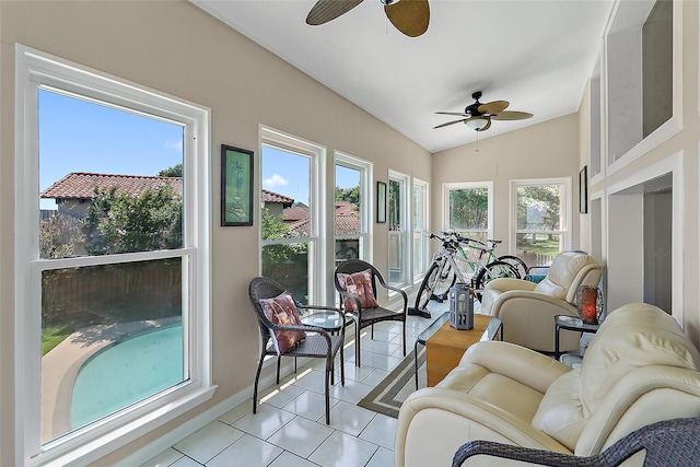 sunroom with lofted ceiling and ceiling fan