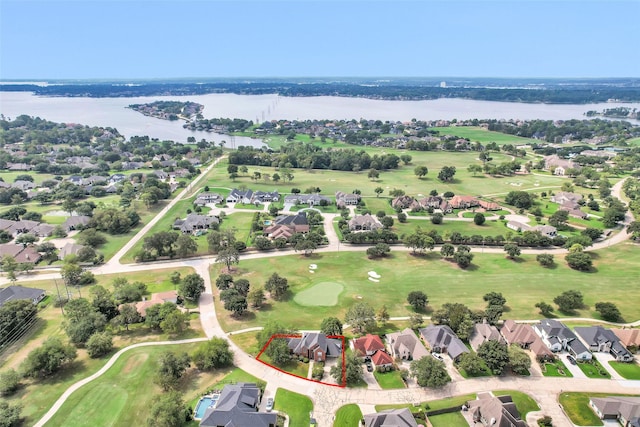 bird's eye view featuring a residential view, view of golf course, and a water view