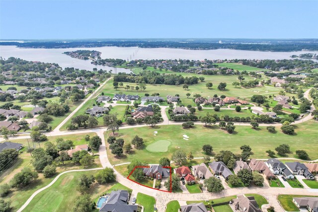 55 Monterrey Rd E, Montgomery, TX 77356 - aerial perspective of suburban area with property boundaries highlighted, a nearby body of water, and a local golf course