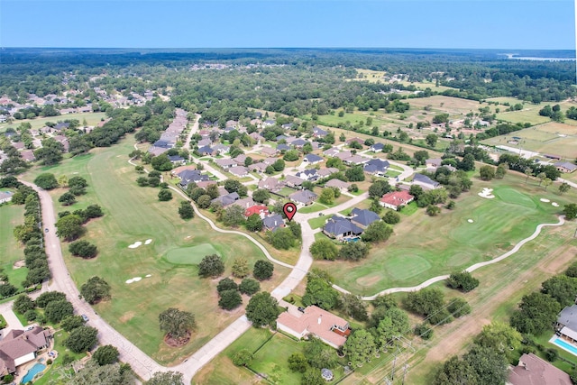 aerial view with golf course view and a residential view