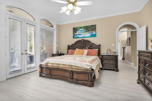 bedroom with ceiling fan, ornamental molding, access to outside, french doors, and light wood-style floors