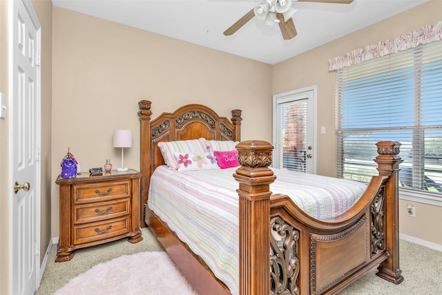 bedroom featuring baseboards, ceiling fan, light carpet, and access to exterior