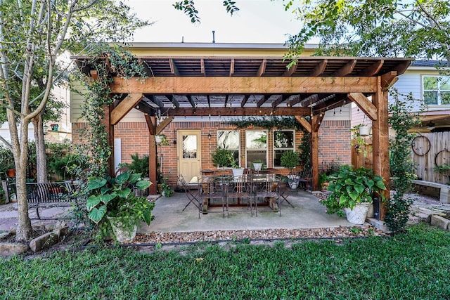 view of patio / terrace featuring a pergola and fence