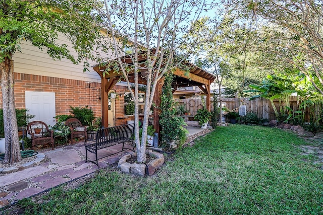 view of yard with a patio and fence