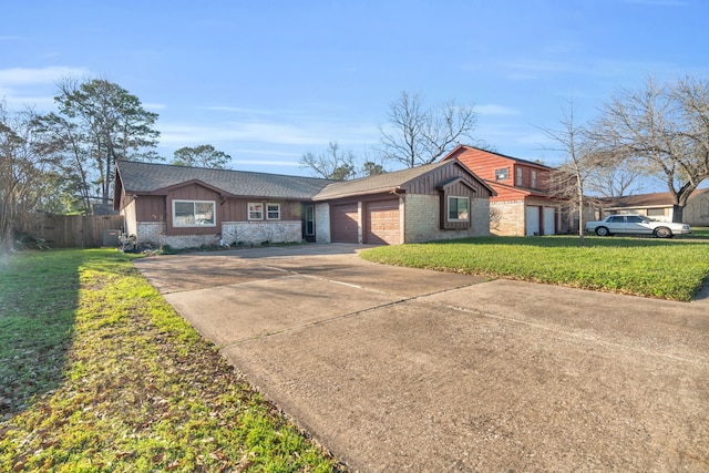 view of front of house with a garage, brick siding, driveway, board and batten siding, and a front yard