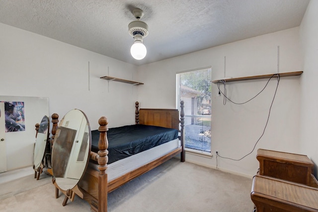 carpeted bedroom with a textured ceiling