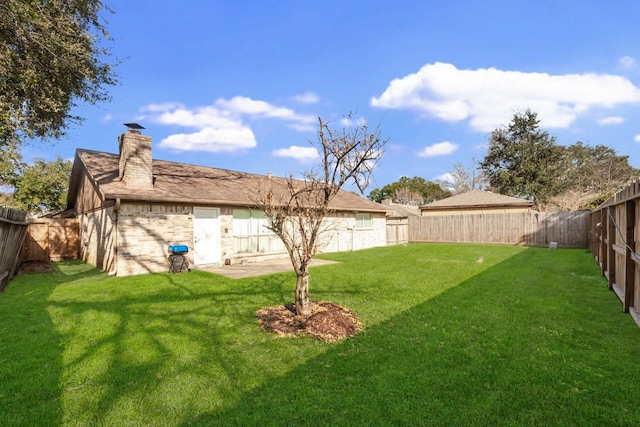 view of yard featuring a fenced backyard