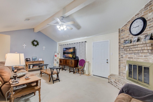 living room with visible vents, lofted ceiling with beams, ceiling fan, carpet flooring, and a brick fireplace