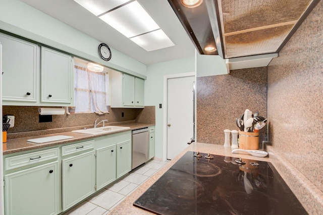 kitchen with light tile patterned floors, dishwasher, backsplash, black electric stovetop, and a sink