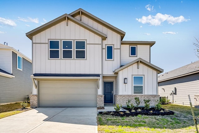 view of front of home with a garage, stone siding, board and batten siding, and driveway