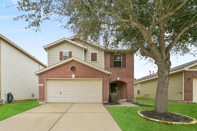 traditional home with a garage, concrete driveway, brick siding, and a front lawn