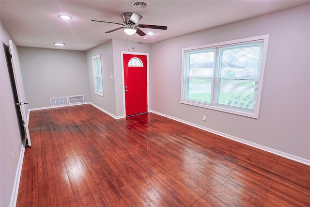 foyer with ceiling fan, visible vents, and plenty of natural light