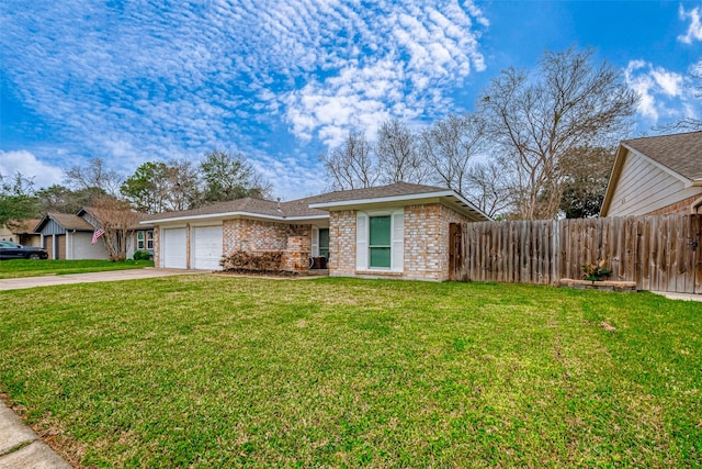 view of front of property with an attached garage, brick siding, fence, concrete driveway, and a front yard